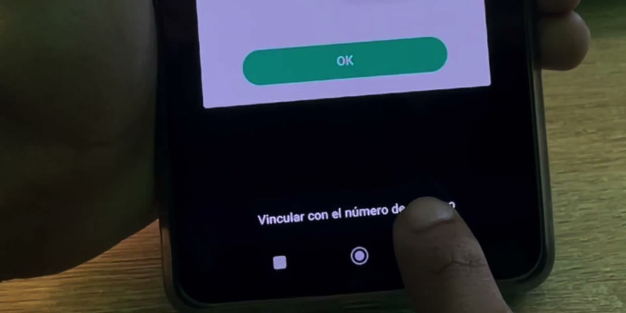 Opción Vincular con el número de teléfono debajo de la cámara para escanear en Android